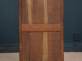 an old wooden cabinet with a marble top and a drawer underneath it