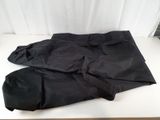 a pair of black pants sitting on a white table
