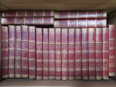 many old books in a box on the shelf