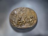 a bronze plaque of a group of people on horseback