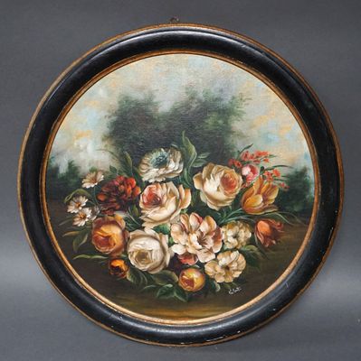 une image représentant un tableau de fleurs dans un cadre noir et doré