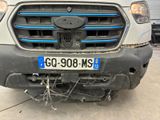 the front bumper of a truck with a number plate on it