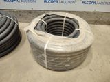 two hoses that are sitting on the ground