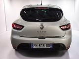 the rear end of a white car in a white room