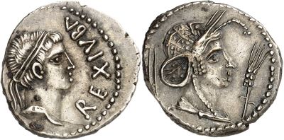 a silver coin with an image of a woman on it