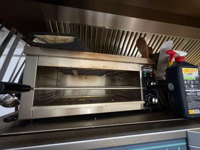 a toaster oven that is sitting on top of a counter