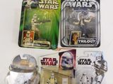 several star wars action figures are displayed on a white surface
