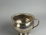 silver plated cup with handle on a white background
