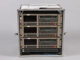 an image of a rack of electronics sitting on top of a white surface