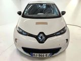 a white car that is parked in a room