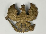 un aigle doré coiffé d'une couronne