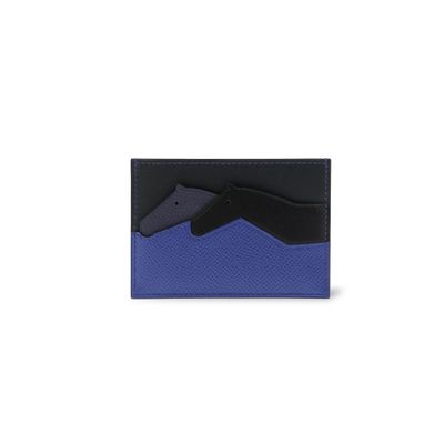 un portefeuille noir et bleu sur lequel est représenté un pistolet