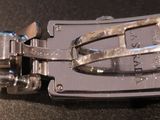 a close up of a metal belt buckle on a table