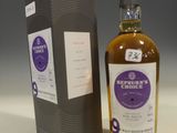 an image of a bottle of whisky sitting next to a box
