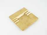 a close up of a gold plate with a latch on it