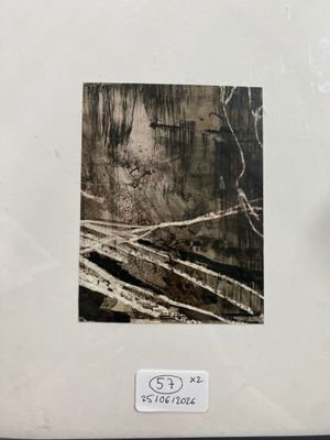 a black and white photo of a clock on a table