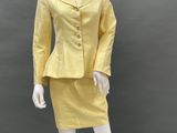 an image of a mannequin dressed in a yellow suit and skirt