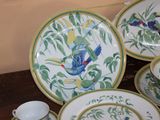 a lot of plates and cups on the table