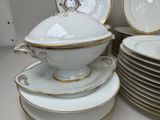 many plates and bowls stacked on top of each other