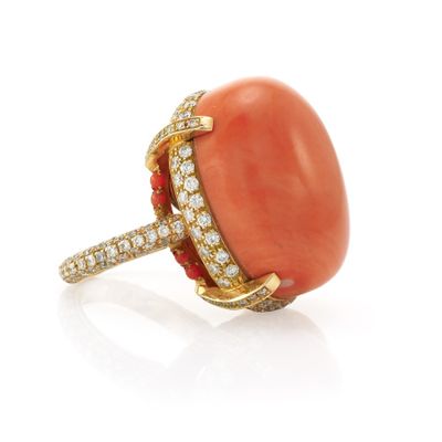 an oval coral and diamond ring, by van cleef