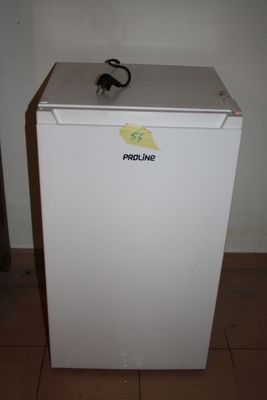 an image of a small white refrigerator in a room