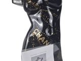 black mannequin with gold and black paint on it ' s torso