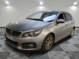 the silver car is parked on a checkered floor in a room