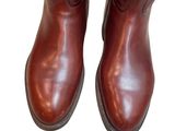 brown leather boots on a white background with a white background