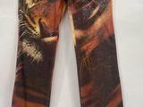 a pair of jeans with a tiger print on them