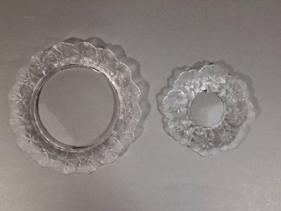 two glass plates that are sitting on a table