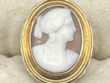 an image of a picture of a woman in a white dress in a gold frame