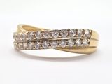 a close up of a gold ring with diamonds on a white background