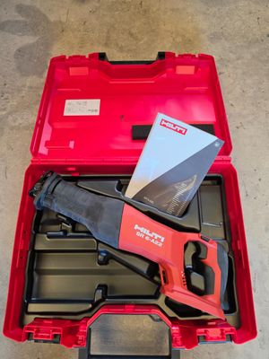 the tools are in the red case on the concrete floor
