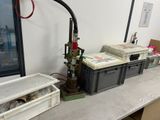 a table with a bunch of boxes and a water heater on it