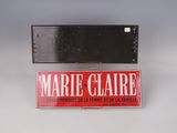 a sign that says marie claire on it and a sign that says marie claire on it