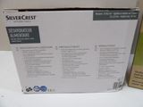 packaging of a silvercrest dishwasher and a dishwasher on a table