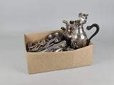silverware in a box with spoons, forks, and a teapot