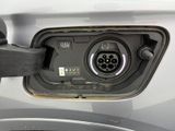 a close up of an electric car charging at a gas station