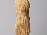 an image of a statue of a woman holding a bowl on her head