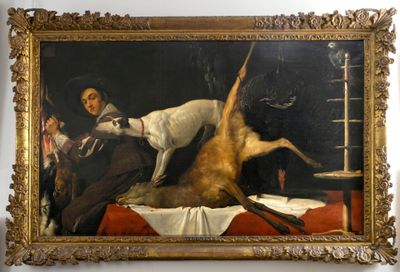 un tableau représentant un homme avec un chien sur un lit
