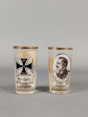 two shot glasses with a picture of a man and a woman on them