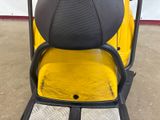 a yellow and black golf cart with a black seat