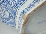 an antique chinese blue and white vase with a bird on it