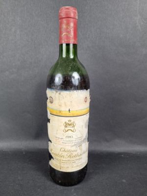a close up of a bottle of wine sitting on a table