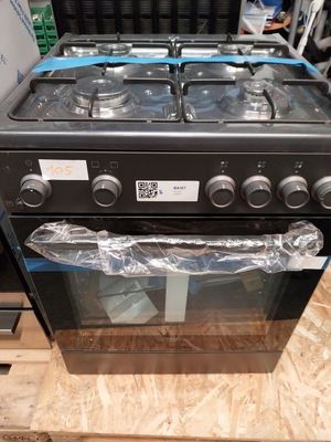 a black stove top oven sitting on top of a wooden table