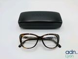 the glasses are next to the case on the table