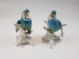 two figurines of birds sitting on top of each other