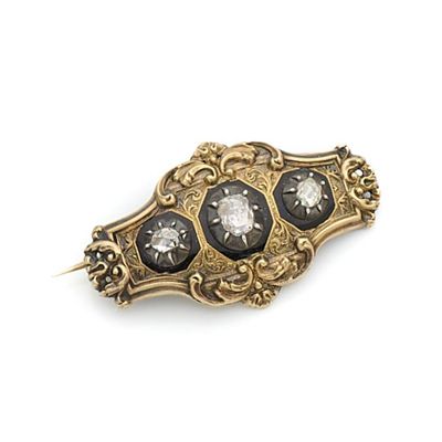 Broche en or 18K (750) et en argent, sertie de diamants tail…