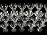 a lot of wine glasses that are sitting on a table