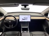 the interior of a tesla vehicle with a large screen on the dashboard